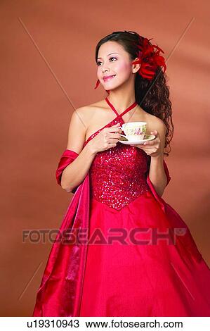 Stock Image - Black Hair, Posing, Formal Clothing, Party Dress, Lifestyles. Fotosearch