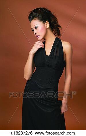 Evening Gown, Fashion, Young Adult, Beautiful, Evening Wear, Asian Ethnicity View Large Photo Image Stock Photograph - Evening Gown, Fashion, Young Adult, Beautiful, Evening Wear, Asian Ethnicity. Fotosearch