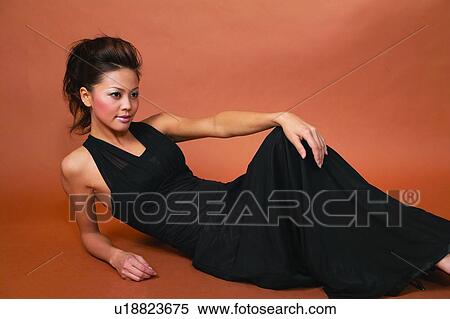 Evening Wear, Smiling, Black Hair, Posing, One Person View Large Photo Image Stock Photography - Evening Wear, Smiling, Black Hair, Posing, One Person. Fotosearch