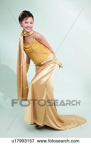 Evening Wear, Toothy Smile, Hands Behind Back, Shadow, Glamour View Large Photo Image Stock Photo - Evening Wear, Toothy Smile, Hands Behind Back, Shadow, Glamour. Fotosearch