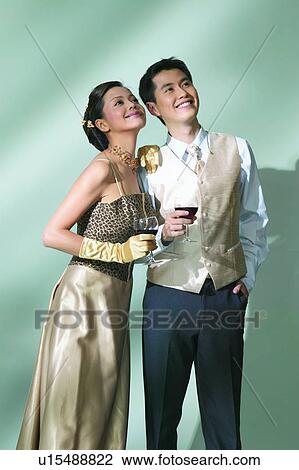 Glamour, Holding, Posing, Formal Clothing View Large Photo Image Stock Image - Glamour, Holding, Posing, Formal Clothing. Fotosearch