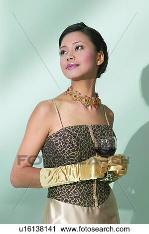 Stock Image - Hair Back, One Young Woman Only, Party, Formal Clothing, Shadow. Fotosearch