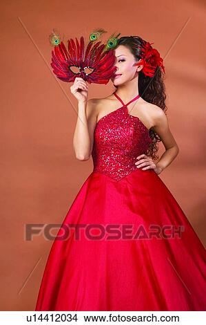 Picture - Hand On Hip, Formal Clothing, Colored Background, Asian Ethnicity, Three-Quarter Length, Evening Gown. Fotosearch