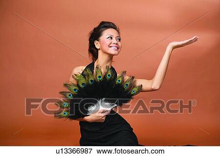 Hand Raised, Indoor, Evening Gown, Looking Up, Well-Dressed View Large Photo Image Stock Photo - Hand Raised, Indoor, Evening Gown, Looking Up, Well-Dressed. Fotosearch