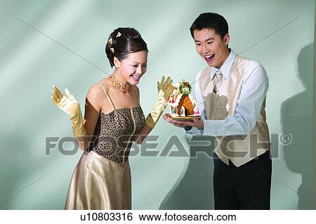 Holding, Dress, Beautiful, Young Couple, Formal Glove, Asian Ethnicity View Large Photo Image Stock Photograph - Holding, Dress, Beautiful, Young Couple, Formal Glove, Asian Ethnicity. Fotosearch