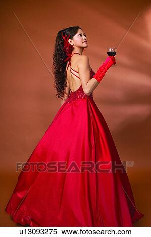 Stock Photography - Holding, Standing, Food And Drink, Beverage, Lifestyles, Three-Quarter Length, Alcohol. Fotosearch