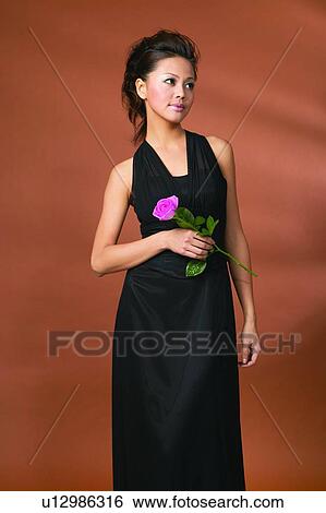 Party Dress, Evening Wear, Standing, Rose, Contemplation View Large Photo Image Stock Photograph - Party Dress, Evening Wear, Standing, Rose, Contemplation. Fotosearch