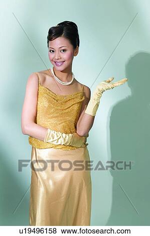 Stock Photo - Shadow, Dress, Toothy Smile, One Person, Asian Ethnicity. Fotosearch