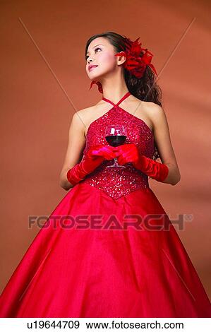 Stock Photo - Standing, Formal Clothing, Posing, Brown, Looking Away, Evening Wear. Fotosearch