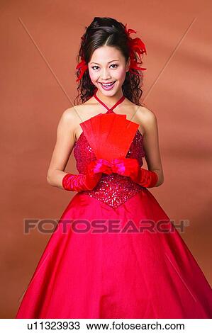 Stock Image - Toothy Smile, Placard, Black Hair, Well-Dressed, Fashion. Fotosearch