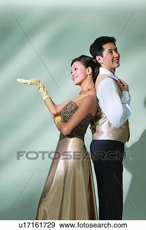 Well-Dressed, Dress, Waistcoat, Adults Only, Young Couple, Black Hair, Party View Large Photo Image Stock Photo - Well-Dressed, Dress, Waistcoat, Adults Only, Young Couple, Black Hair, Party. Fotosearch
