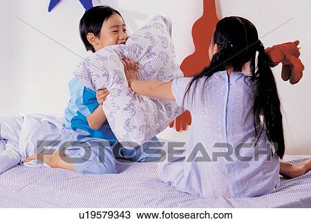 Stock Image - 7-8 years, bed room, lying, bed linen, lifestyle, 5-6 years. Fotosearch