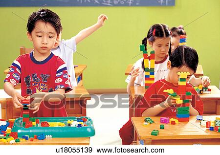 Stock Photo - 7-8 years, blocks, asian ethnicity, 5-6 years. Fotosearch