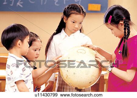 Stock Photo - 7-8 years, child, asian ethnicity, 5-6 years. Fotosearch