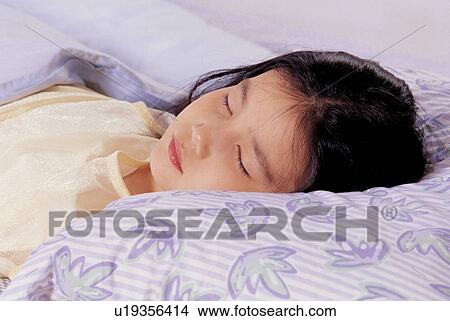 Picture - asian ethnicity, bedroom, bed room, 7-8 years. Fotosearch