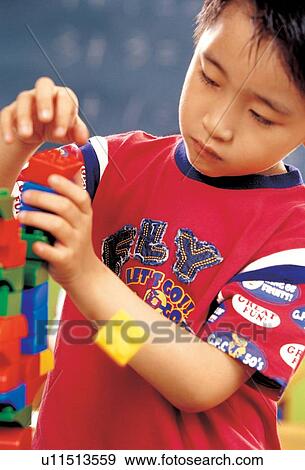 Stock Photo - asian ethnicity, child, blocks, 5-6 years. Fotosearch
