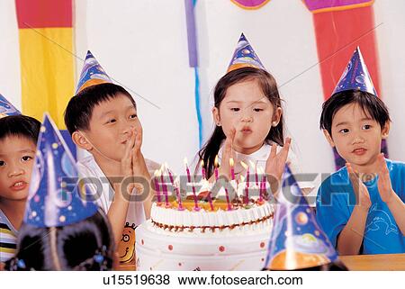 Stock Photo - , birthday cake, cake, asian ethnicity, boys. Fotosearch