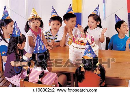, birthday caps, young, cake, asian ethnicity, celebration, cheerful View Large Photo Image Stock Image - , birthday caps, young, cake, asian ethnicity, celebration, cheerful. Fotosearch