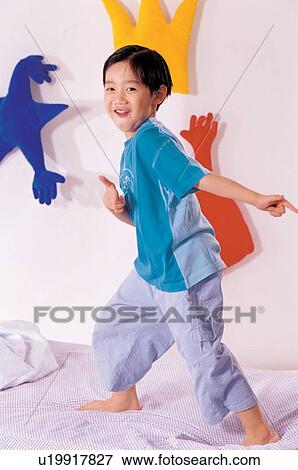 Stock Photo - boy, shapes, standing, childhood, young. Fotosearch