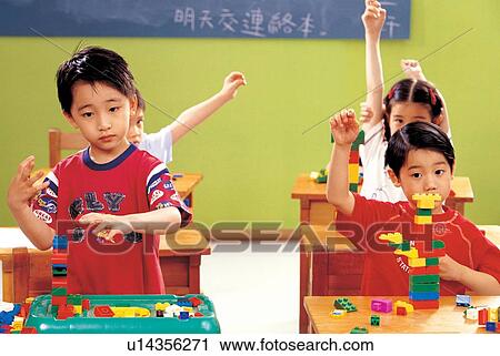 building blocks, looking at camera, young, school boys, hand raised, in a row View Large Photo Image Stock Image - building blocks, looking at camera, young, school boys, hand raised, in a row. Fotosearch