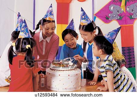 Picture - , cake, half length, celebration, joy, birthday caps, lifestyle. Fotosearch