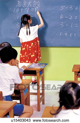 Stock Image - childhood, culture, sitting, only children, lifestyle, black board. Fotosearch