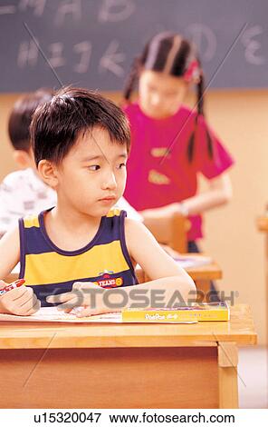 Stock Photo - childhood, education, children, head and shoulders, one person, textbook. Fotosearch