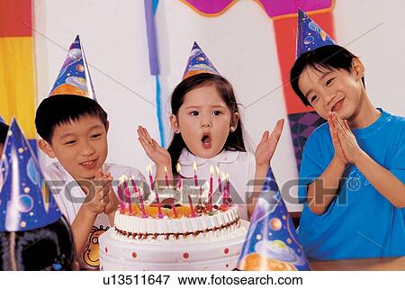 Stock Photo - girls, cheerful, celebration, asian ethnicity, childhood, smiling, lifestyle. Fotosearch
