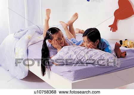 lifestyle, asian ethnicity, boy, lying down, relaxing, bed linen View Large Photo Image Stock Photo - lifestyle, asian ethnicity, boy, lying down, relaxing, bed linen. Fotosearch
