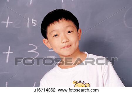 Stock Image - looking at camera, asian ethnicity, cheerful, playful, lifestyle. Fotosearch