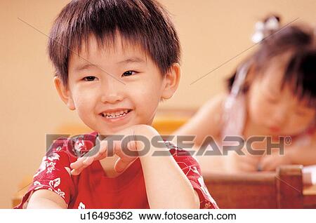 Stock Image - people in background, playful, childhood, head and shoulders, learning, children. Fotosearch
