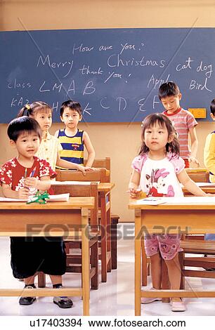 Picture - playful, book, elementary students, art work, blackboard, childhood. Fotosearch