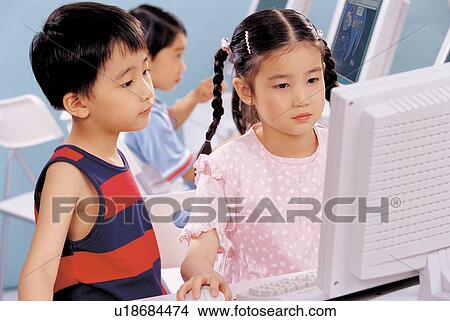 Picture - terminal, 5-6 years, young, looking at computer, technology, computer class, knowledge. Fotosearch