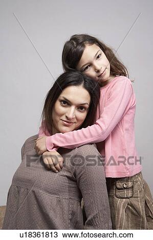 Daughter (5-7)embracing mother, portrait View Large Photo Image Stock Image - Daughter (5-7)embracing mother, portrait. Fotosearch