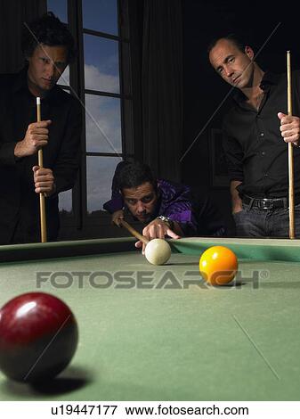 Stock Photo - Men playing snooker. Fotosearch