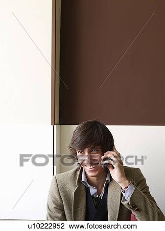 Portrait of teenage male on a mobile View Large Photo Image Stock Image - Portrait of teenage male on a mobile. Fotosearch