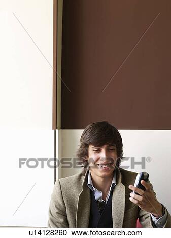 Portrait of teenage male on a mobile View Large Photo Image Stock Image - Portrait of teenage male on a mobile. Fotosearch