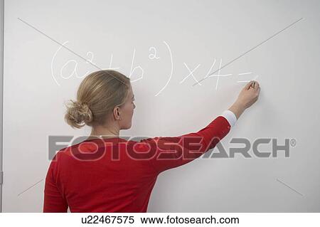 Teacher writing on whiteboard View Large Photo Image Stock Photography - Teacher writing on whiteboard. Fotosearch
