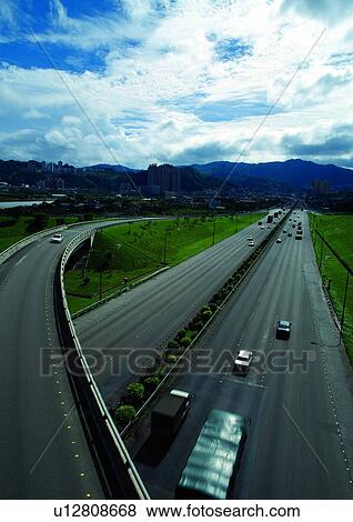 Stock Photo - Cloud, Lane, Grassy, Driving, Building, Car. Fotosearch