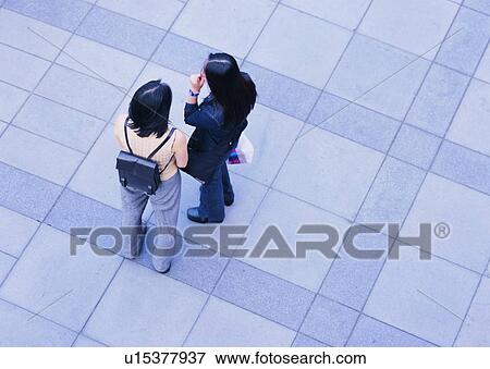 woman, rush, chatting, transportation, people, city View Large Photo Image Stock Photo - woman, rush, chatting, transportation, people, city. Fotosearch