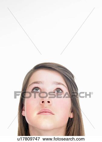 Stock Photo - Girl looking up. Fotosearch