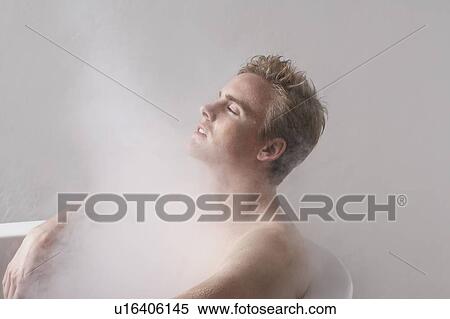 Stock Photography - Man in bath with steam.. Fotosearch