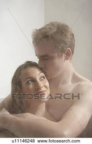 Man kissing a woman in the bath. View Large Photo Image Stock Photo - Man kissing a woman in the bath.. Fotosearch