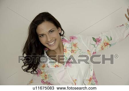 Stock Image - Portrait of a woman in pajamas. Fotosearch