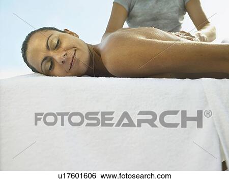 Stock Photograph - Woman receiving a luxury massage . Fotosearch