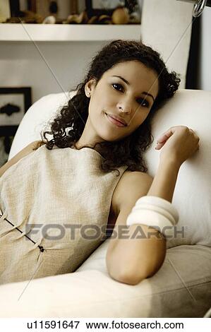 Woman sitting casually. View Large Photo Image Stock Photo - Woman sitting casually.. Fotosearch