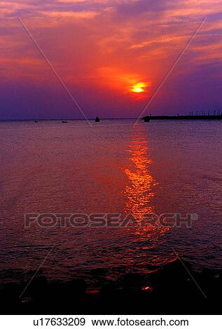 Stock Photo - pier, sunset, sky, ocean, sun, sea. Fotosearch