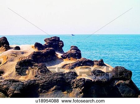 Stock Photo - sky, sea, ship, rock, coast, ocean. Fotosearch