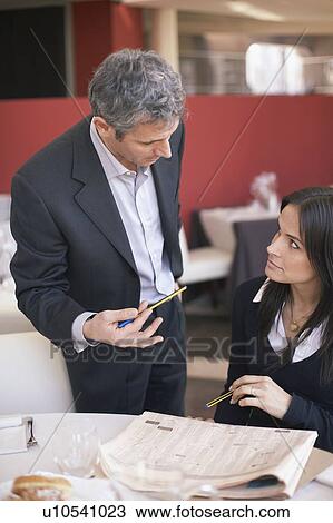 Business people reviewing stock prices View Large Photo Image Stock Image - Business people reviewing stock prices. Fotosearch