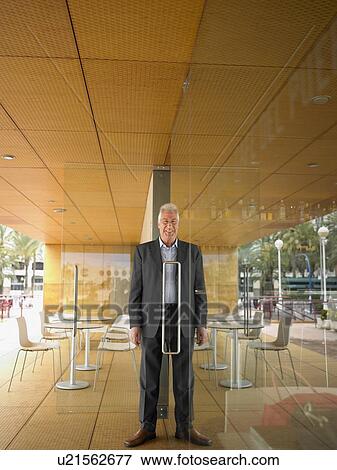 Man half in half out of doorway. View Large Photo Image Stock Photo - Man half in half out of doorway.. Fotosearch